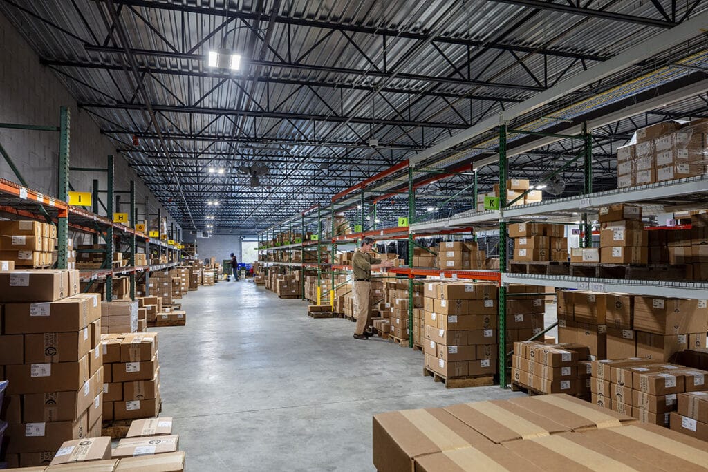 High-capacity warehouse storage facility for construction materials with organized shelving and inventory management.