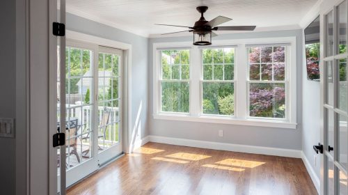1800’s Reconstruction interior with restored hardwood floors, large windows, and ceiling fan